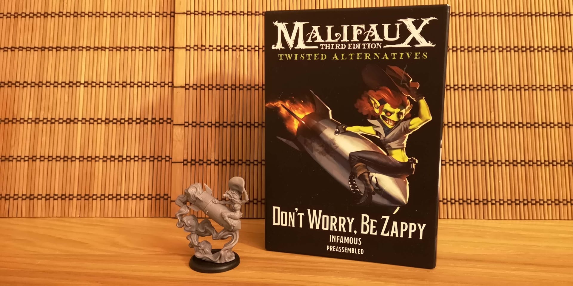 Malifaux Don't Worry Be Zappy Box and Miniature.